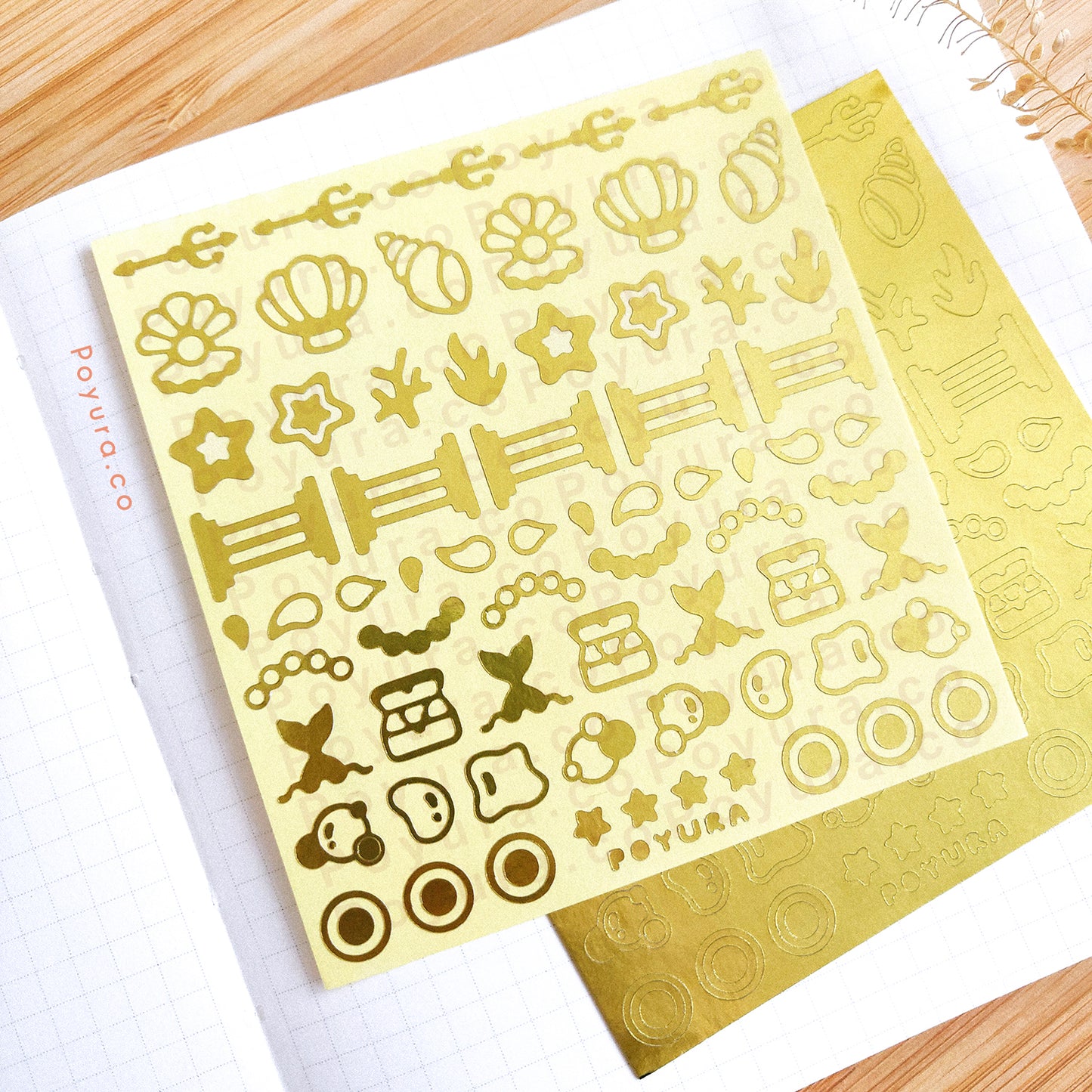Borderless sticker with ocean Atlantis cutouts in gold foil