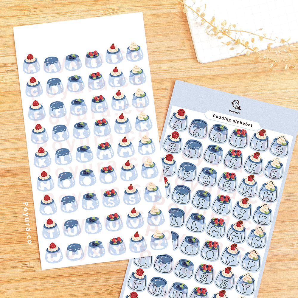Sticker sheet of blue puddings with alphabet letter cutout in the center.
