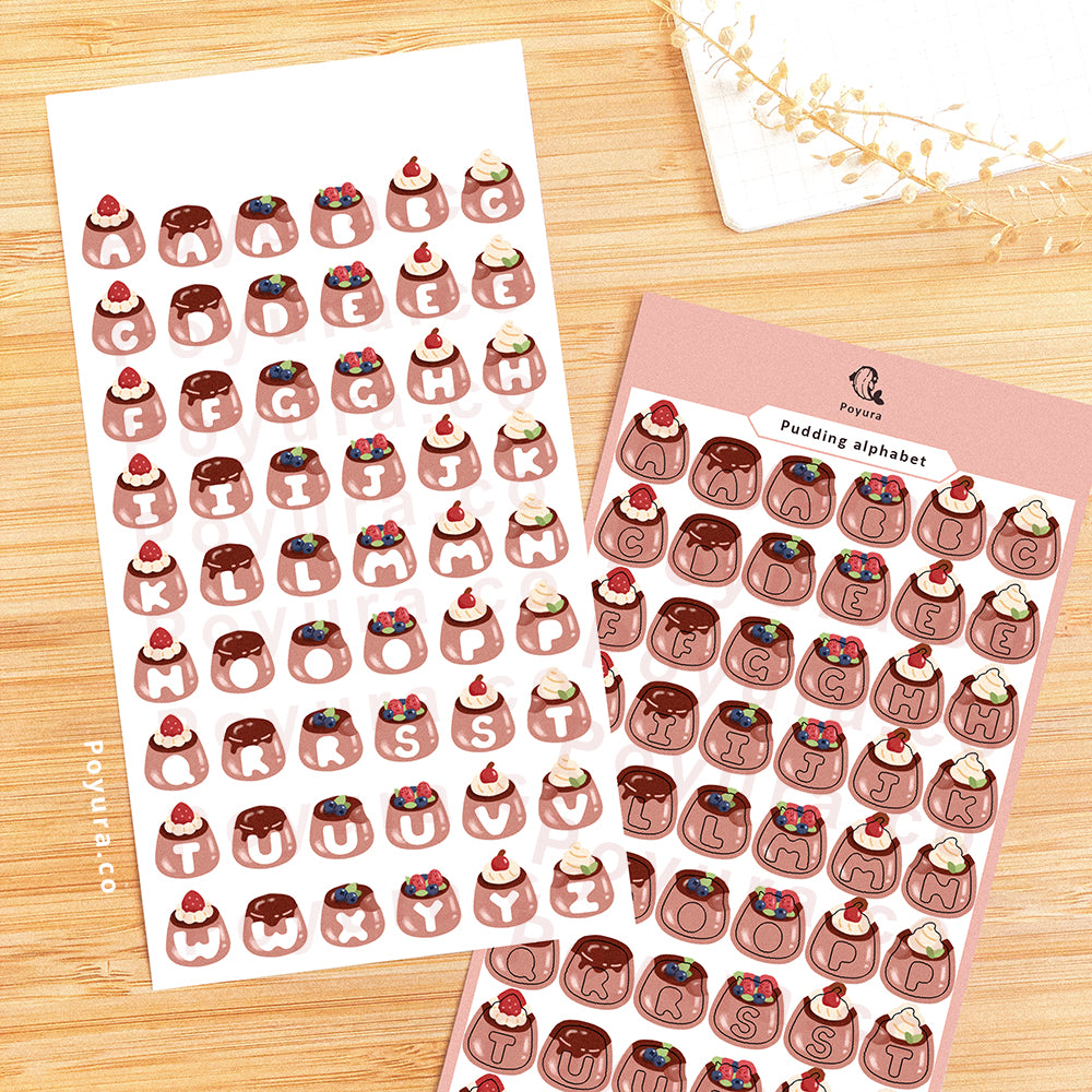 Sticker sheet of brown puddings with alphabet letter cutout in the center.