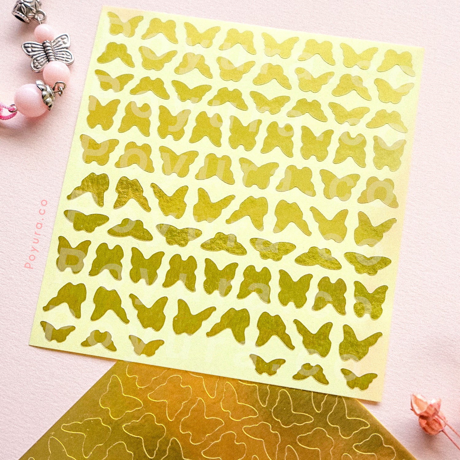Borderless sticker with butterfly cutouts in gold foil