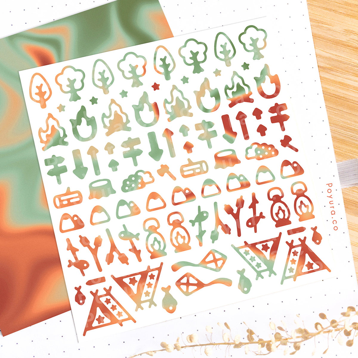 Borderless sticker with camping and tree cutouts in different red and green tints
