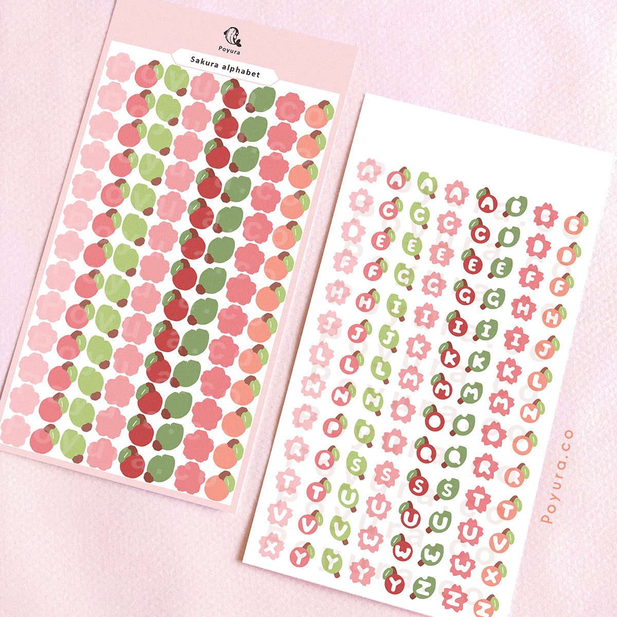 Sticker sheets of sakura, cherry, and leaves. They have alphabet letter cutouts in the center.