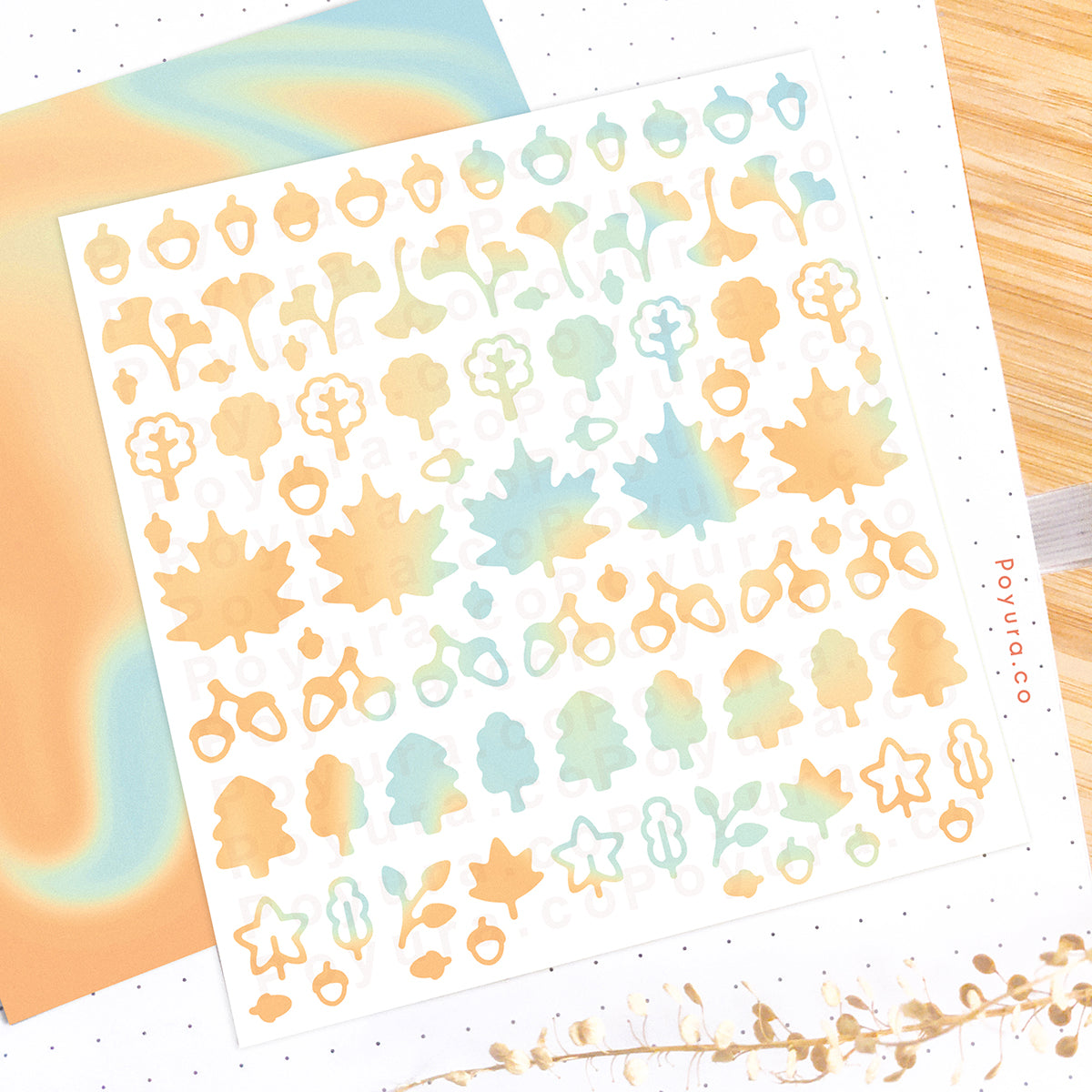 Borderless sticker with leaf and acorn cutouts in different blue and yellow tints