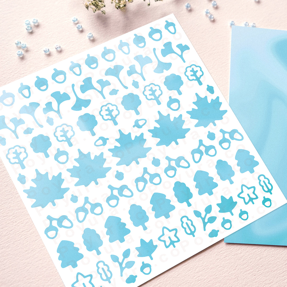 Borderless sticker with leaf and acorn cutouts in different blue tints