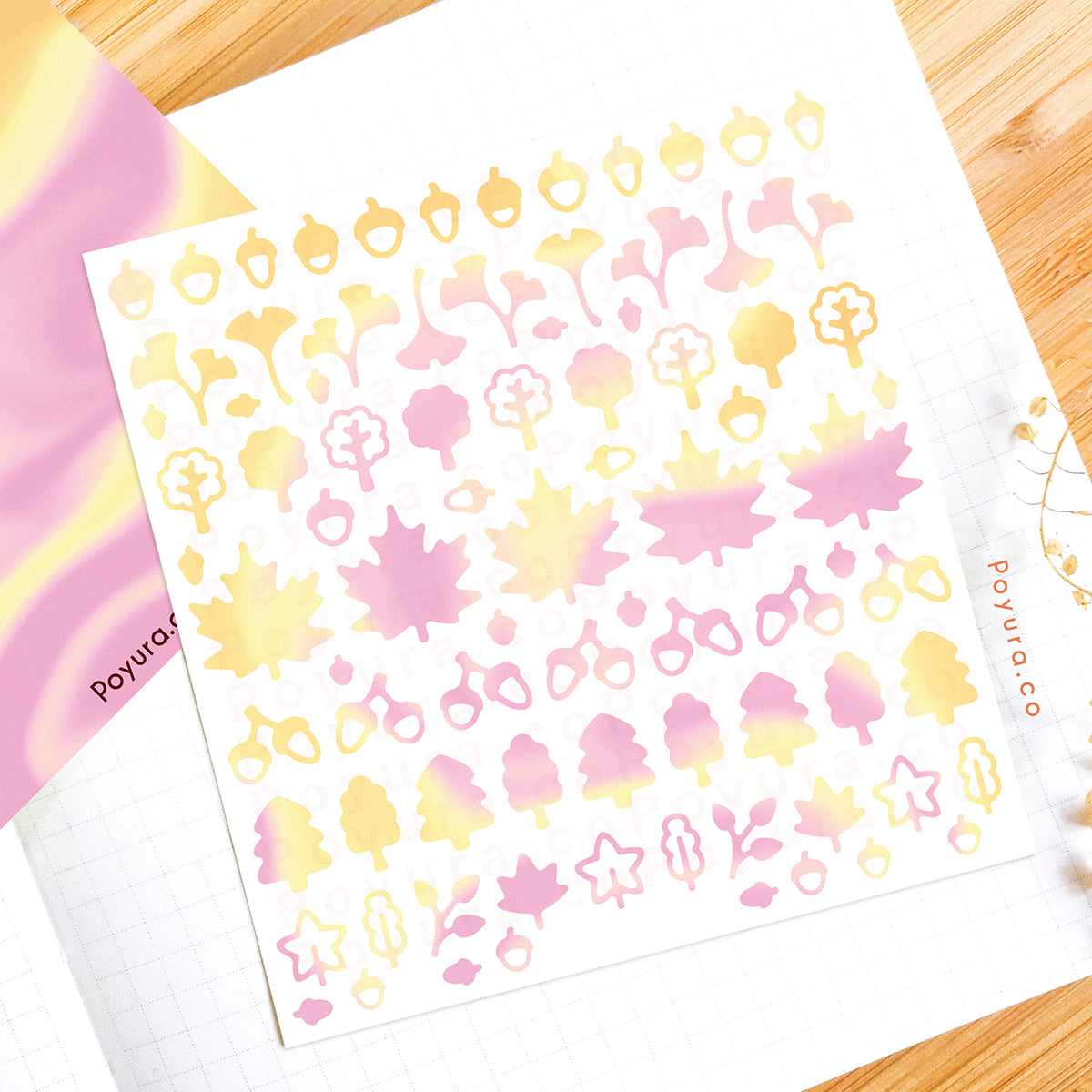 Borderless sticker with leaf and acorn cutouts in different yellow and pink tints