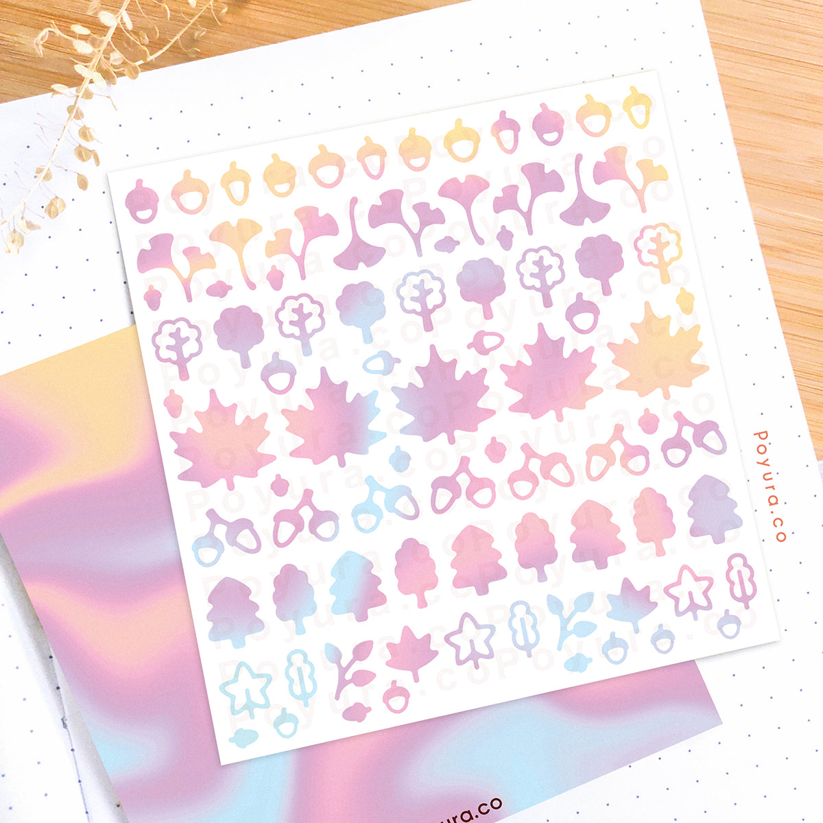 Borderless sticker with leaf and acorn cutouts in different yellow, pink, purple, and blue tints