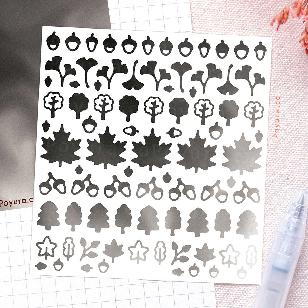 Borderless sticker with leaf and acorn cutouts in different grey tints