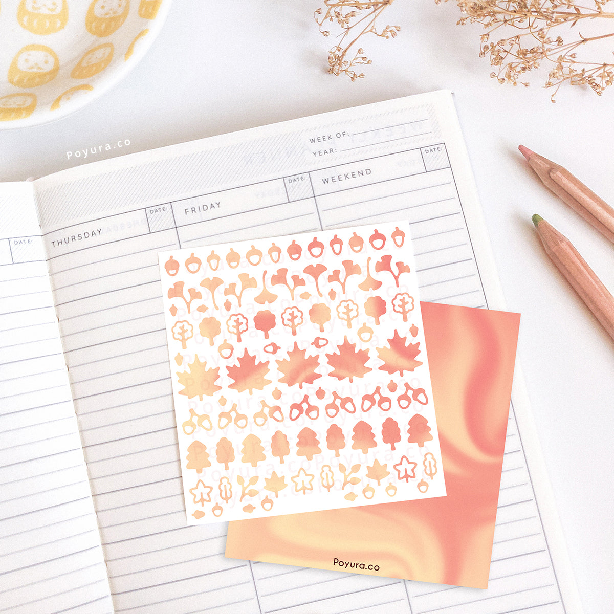Borderless sticker with leaf and acorn cutouts in different pink tints