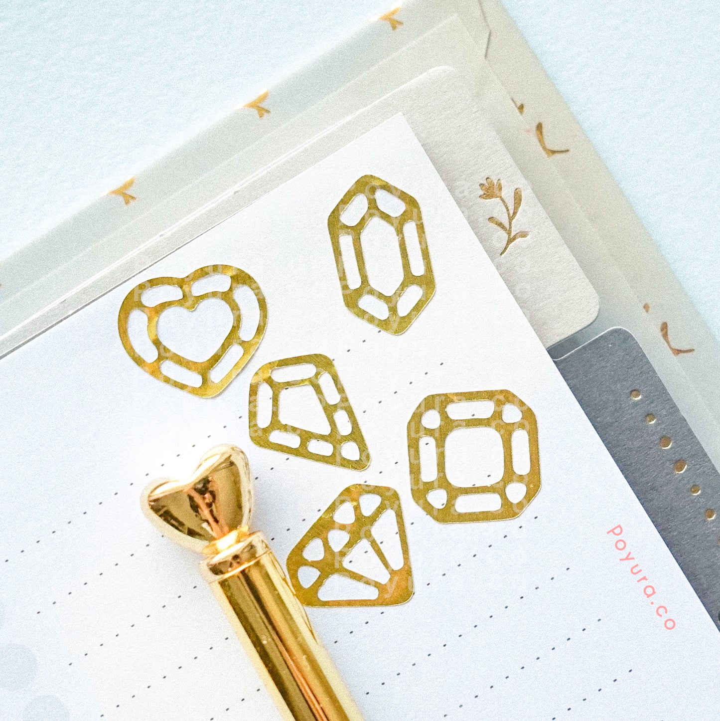Borderless sticker with gemstone and crystal cutouts in gold foil