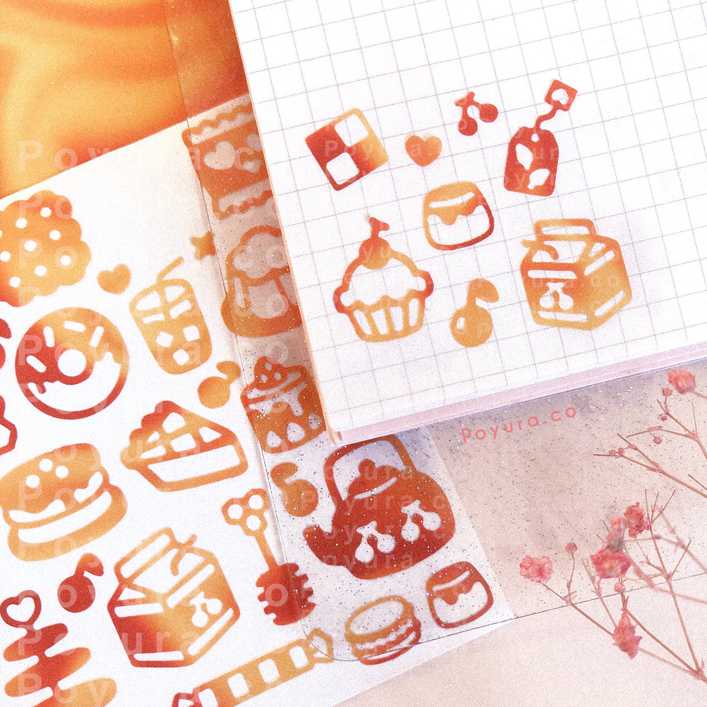 Borderless tiny stickers with high tea snack cutouts in red and orange tints on a journal