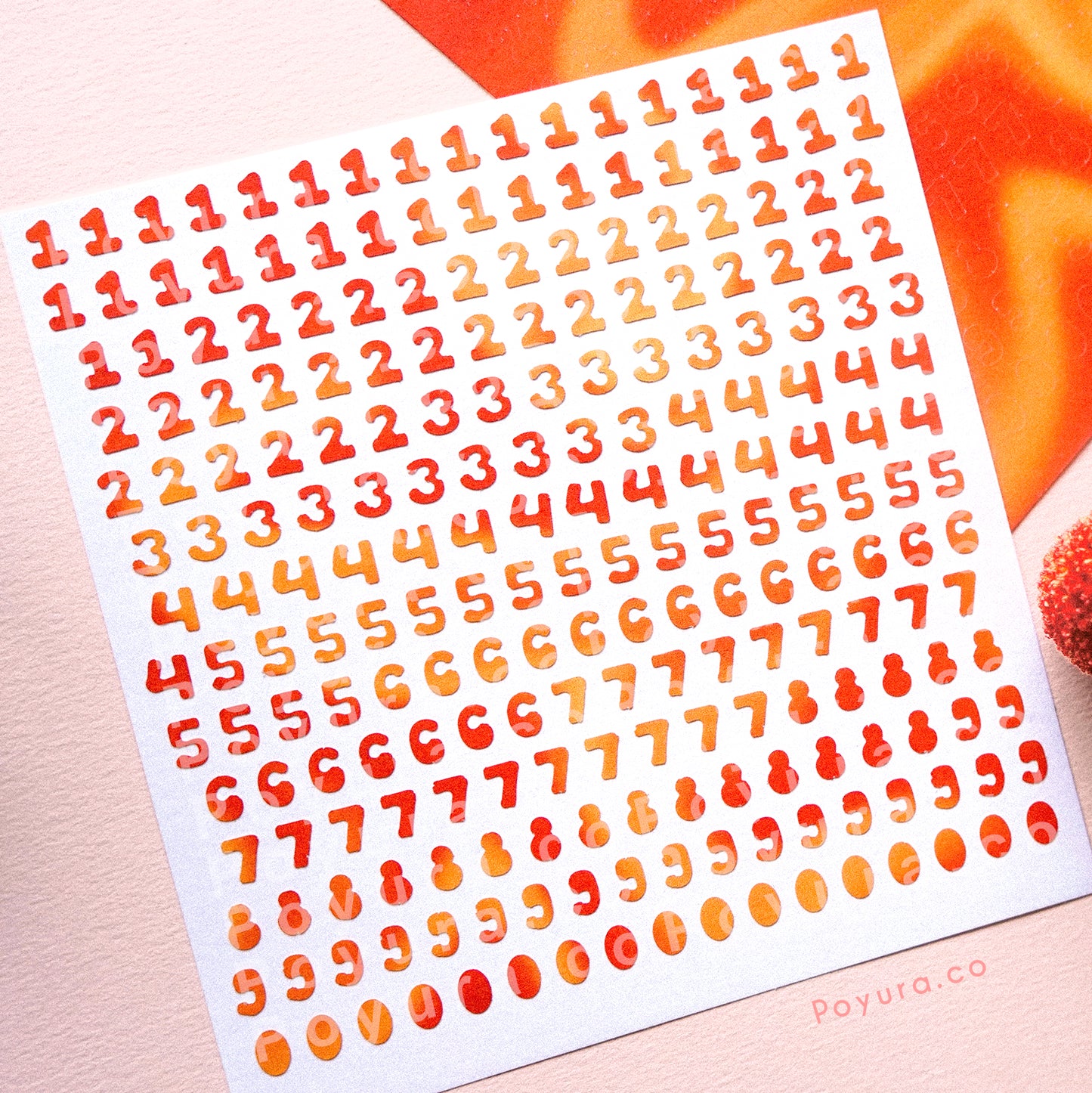 Borderless sticker with number cutouts in different red and orange tints