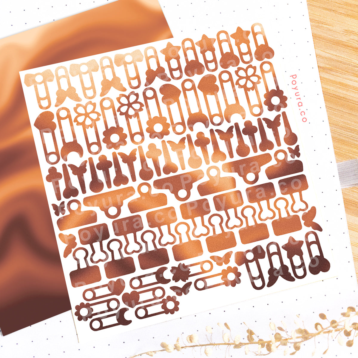 Borderless sticker with paperclips and thumbtack cutouts in different brown tints