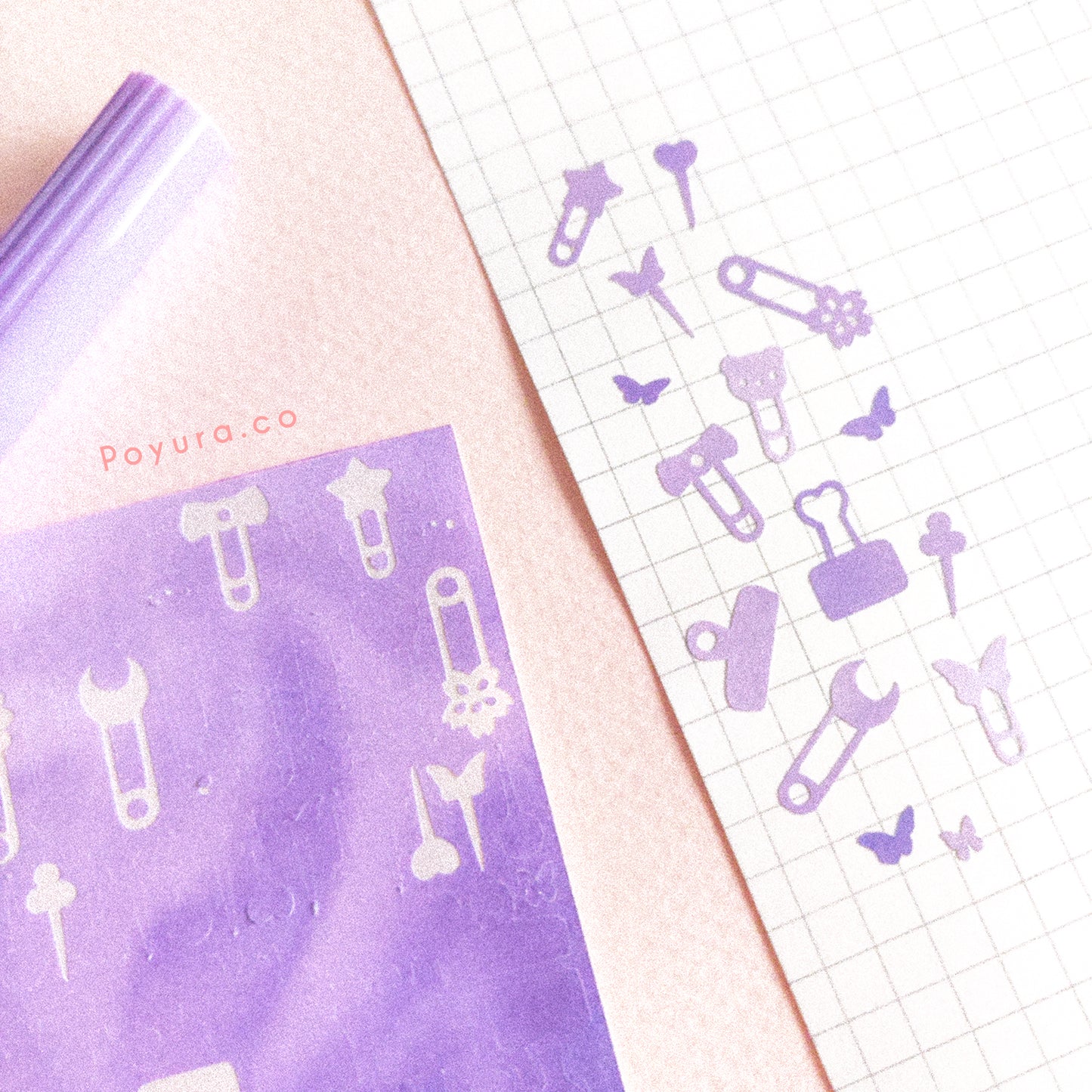 Borderless sticker with paperclips and thumbtack cutouts in different purple tints