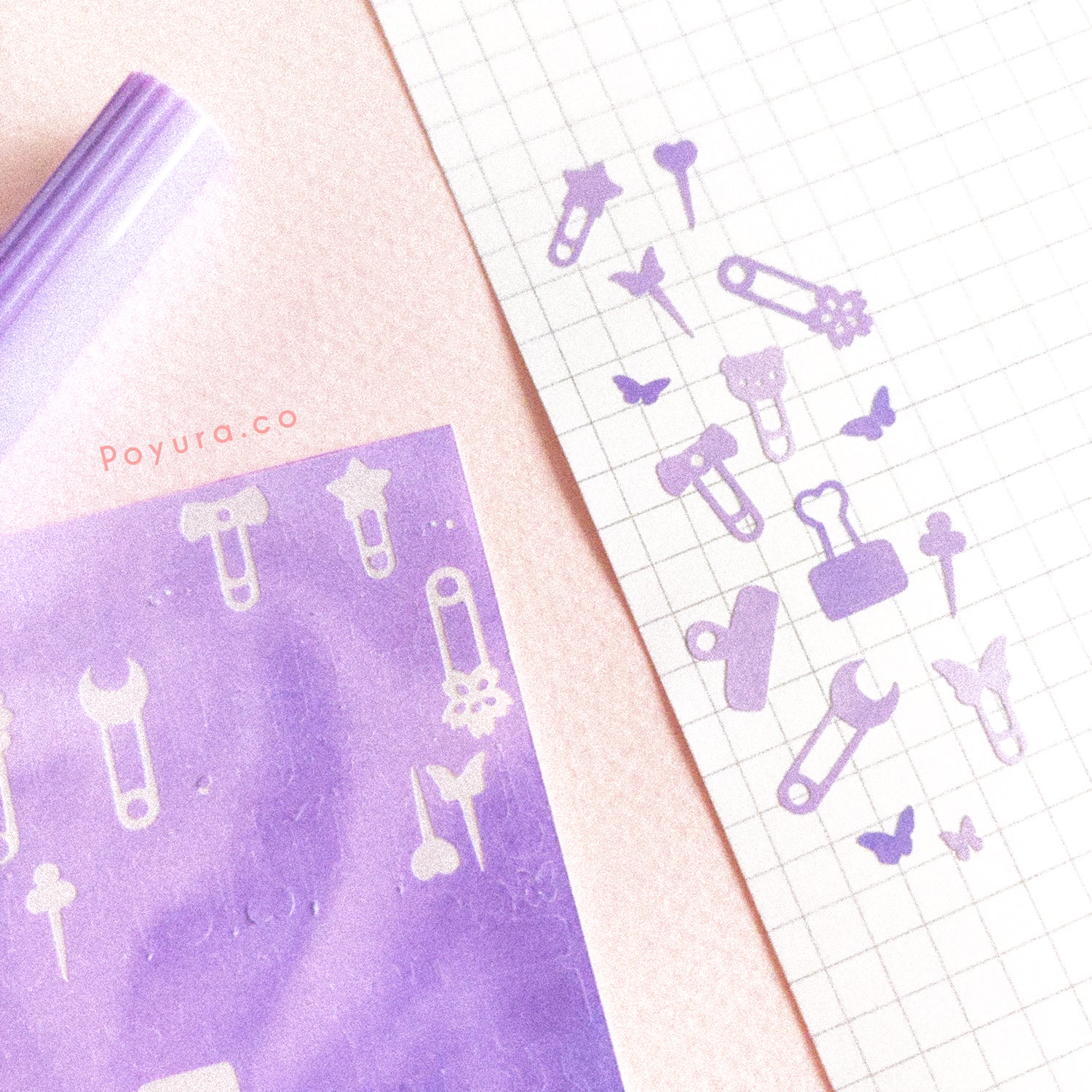 Borderless sticker with paperclips and thumbtack cutouts in different purple tints
