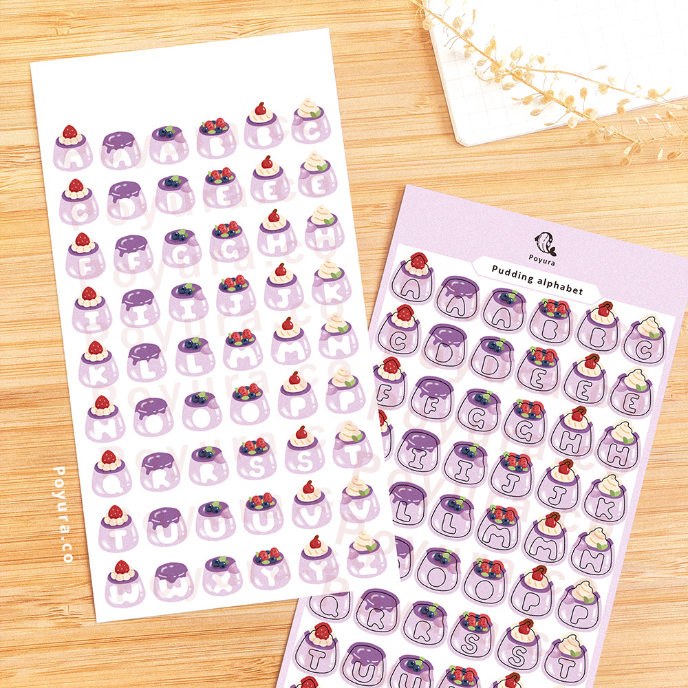 Sticker sheet of purple puddings with alphabet letter cutout in the center.