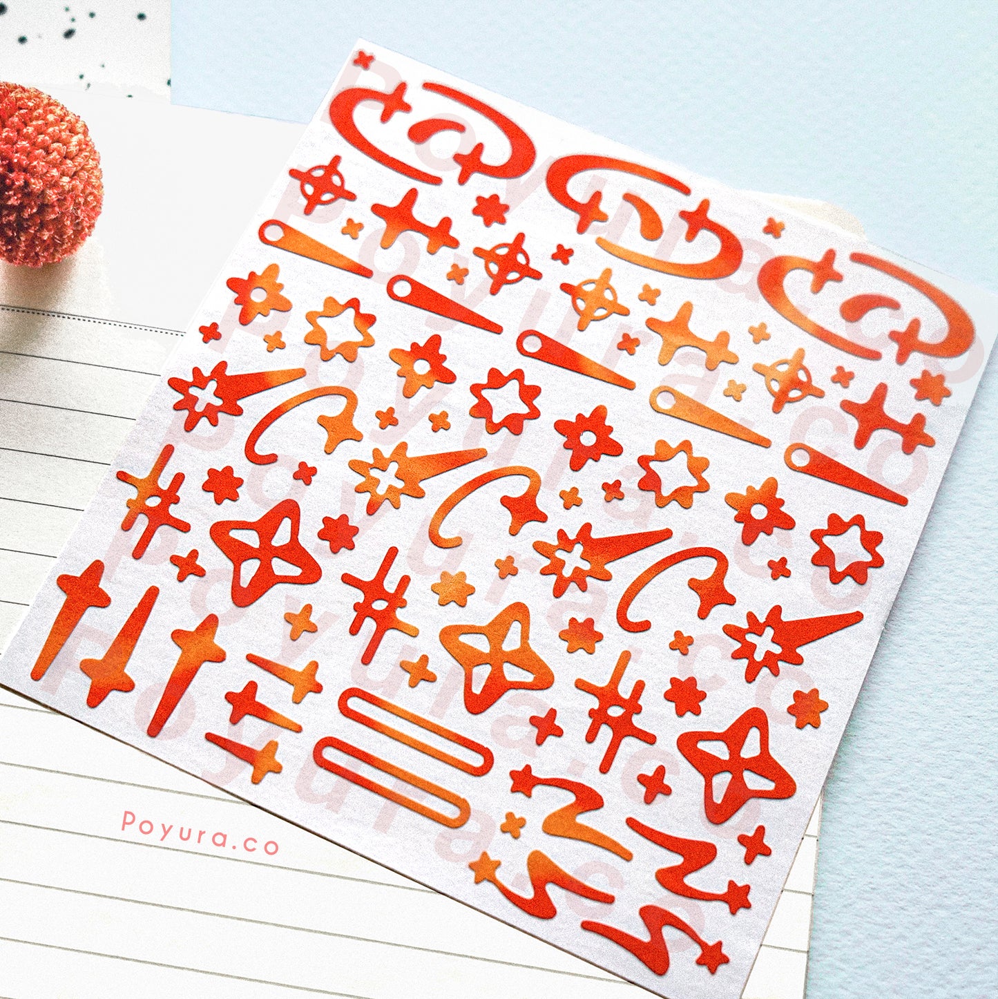 Borderless sticker with shooting star and sparkle cutouts in different red and orange tints