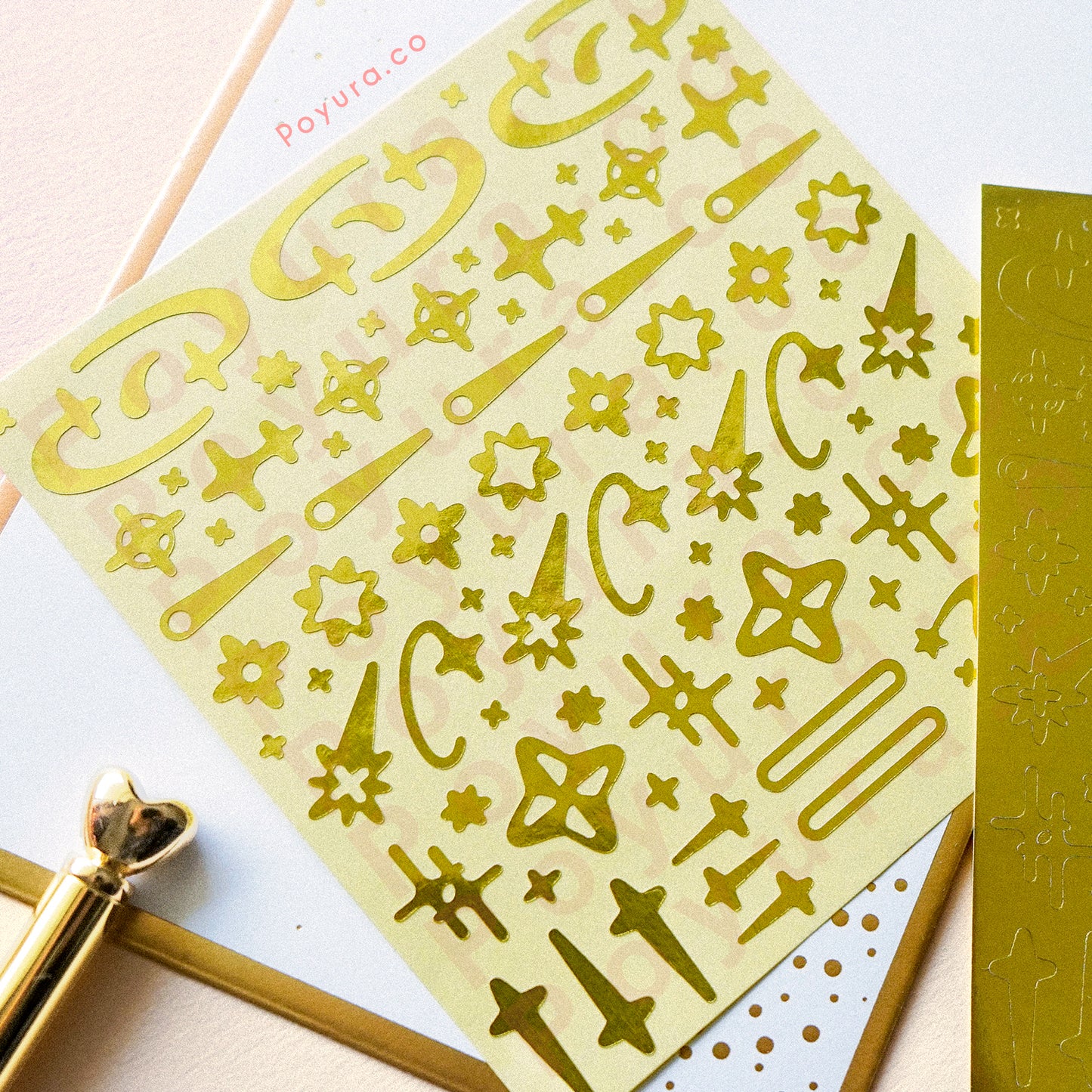 Borderless sticker with shooting star and sparkle cutouts in gold foil