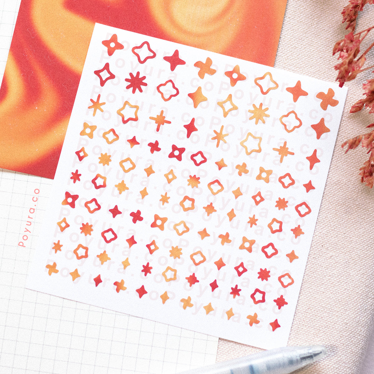 Borderless sticker with sparkle cutouts in different red and orange tints