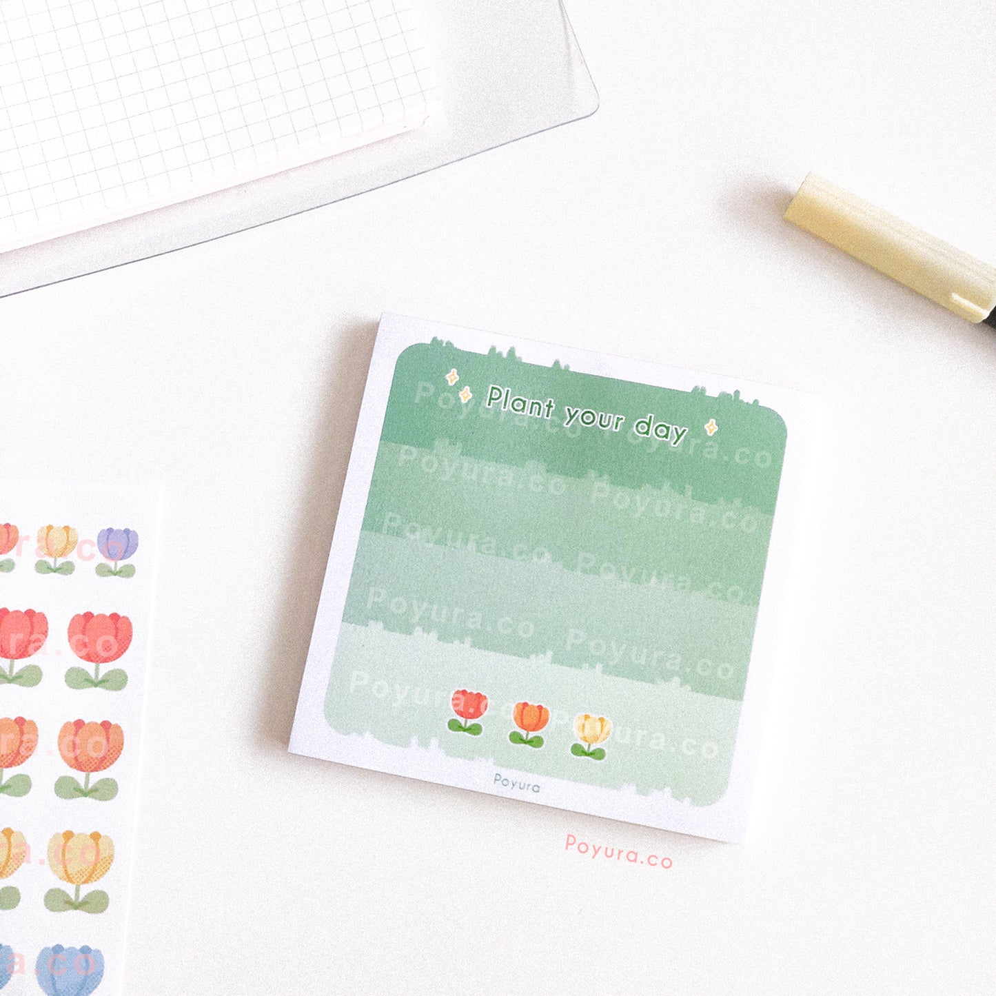Memo notepad of a grass field with colorful tulips