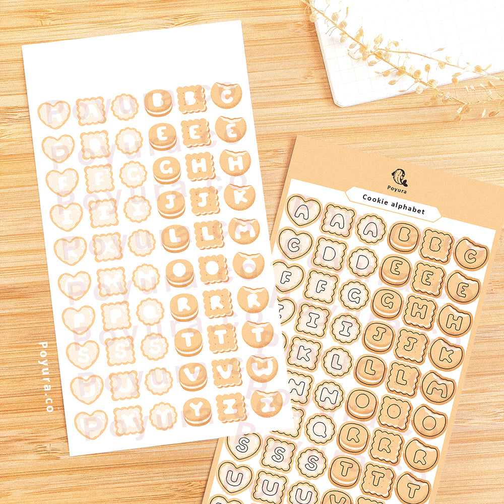 Sticker sheet of natural cookies with alphabet letter cutouts in the center.