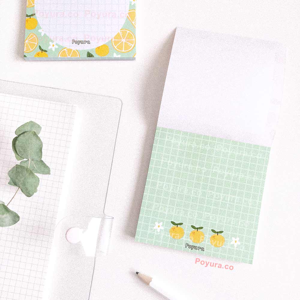 Green memo notepad with grid yuzus and flowers