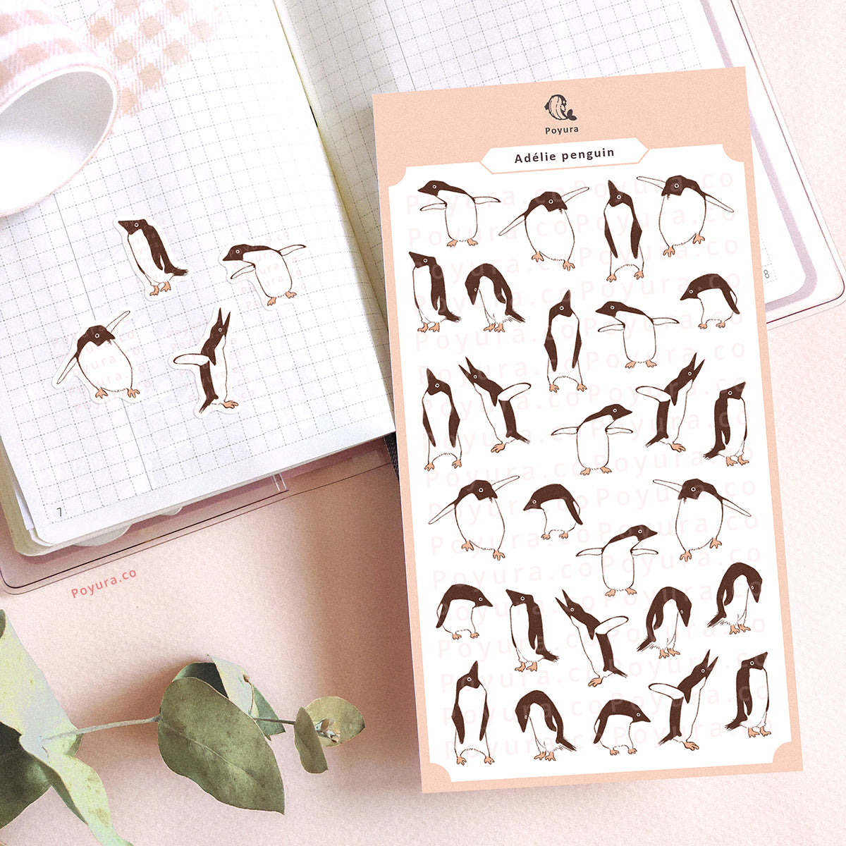 Stickers of cute, silly adélie penguins on a journal