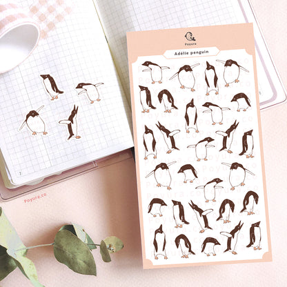 Stickers of cute, silly adélie penguins on a journal