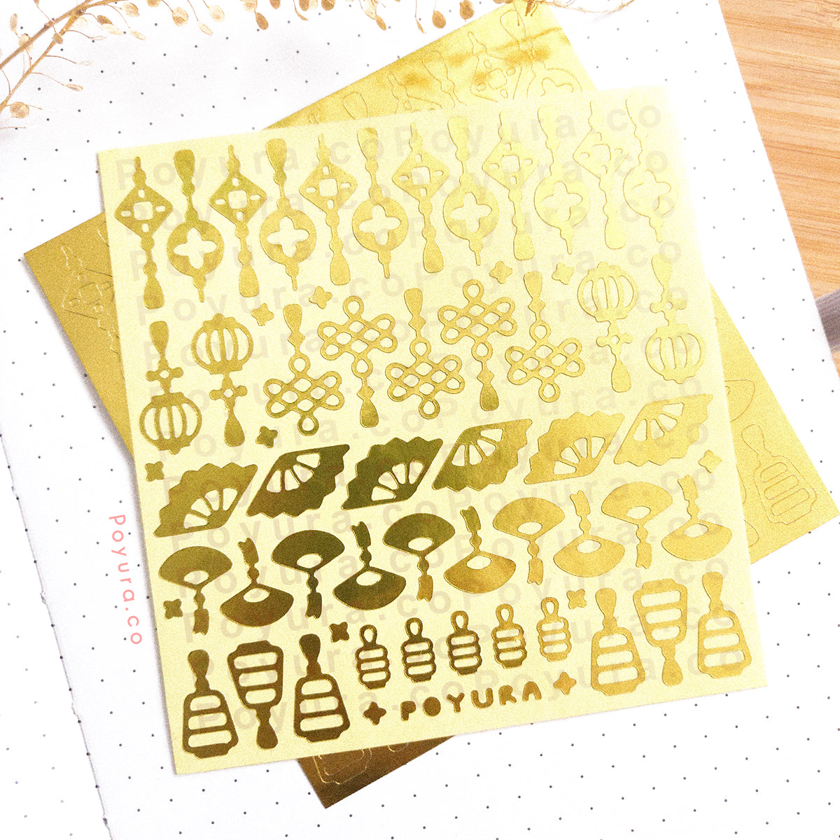 Borderless sticker with Asian lantern and fan cutouts in gold foil