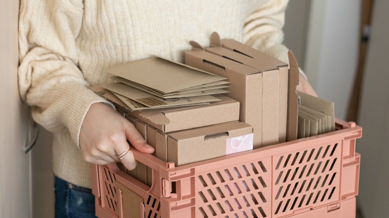 Envelops and shipping boxes in a basket