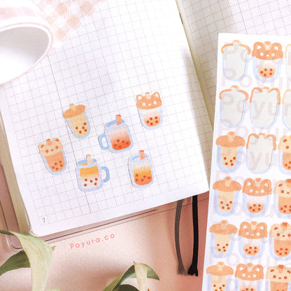 A sticker sheet of orange bubble tea on a notebook