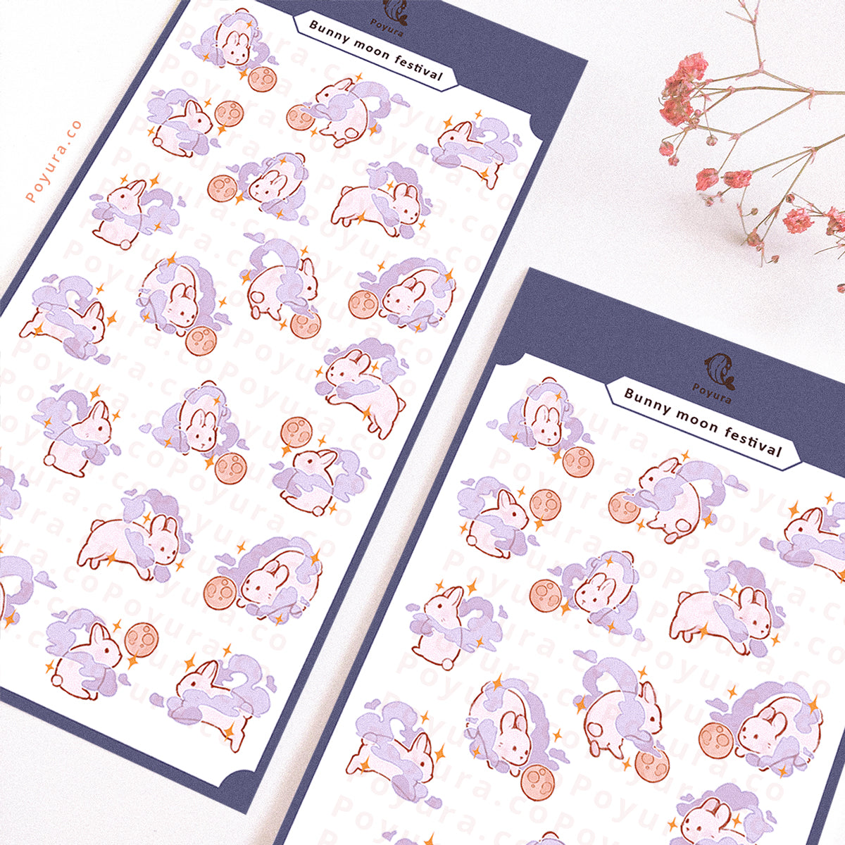 Sticker sheet of white bunnies with a purple cloud around them. They are playing with a moon as a ball.