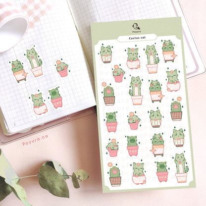 Journal spread decorated with stickers of cats that look like cactus in pots.