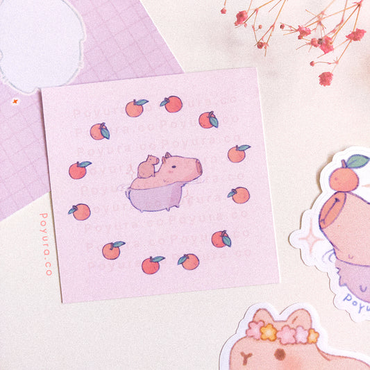 Mini art print with cute capybaras surrounded by oranges