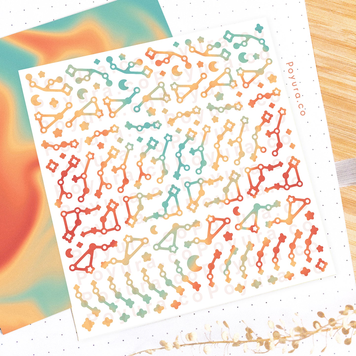 Borderless sticker with constellation star cutouts in different red, orange, and green tints