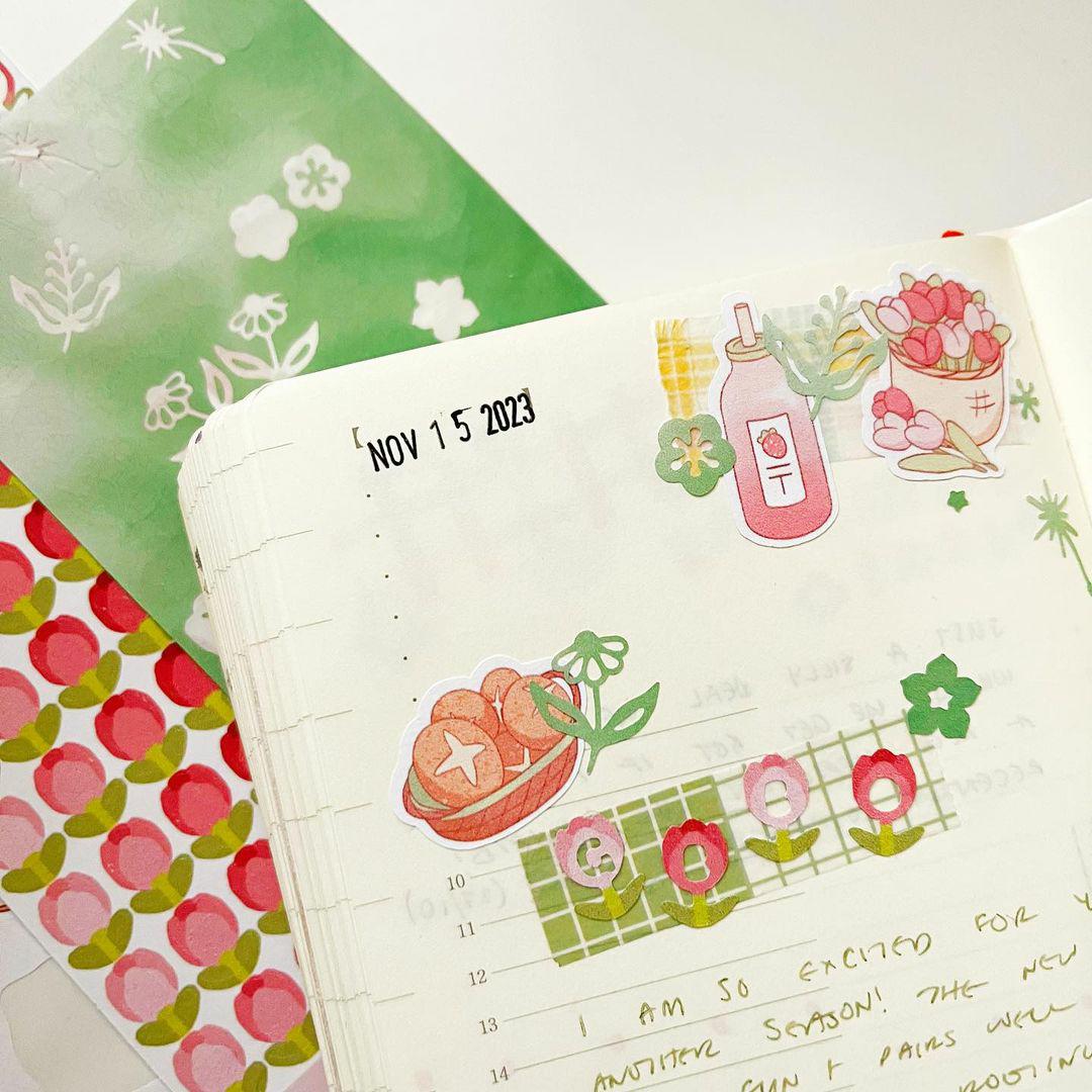 Journal spread decorated with stickers.