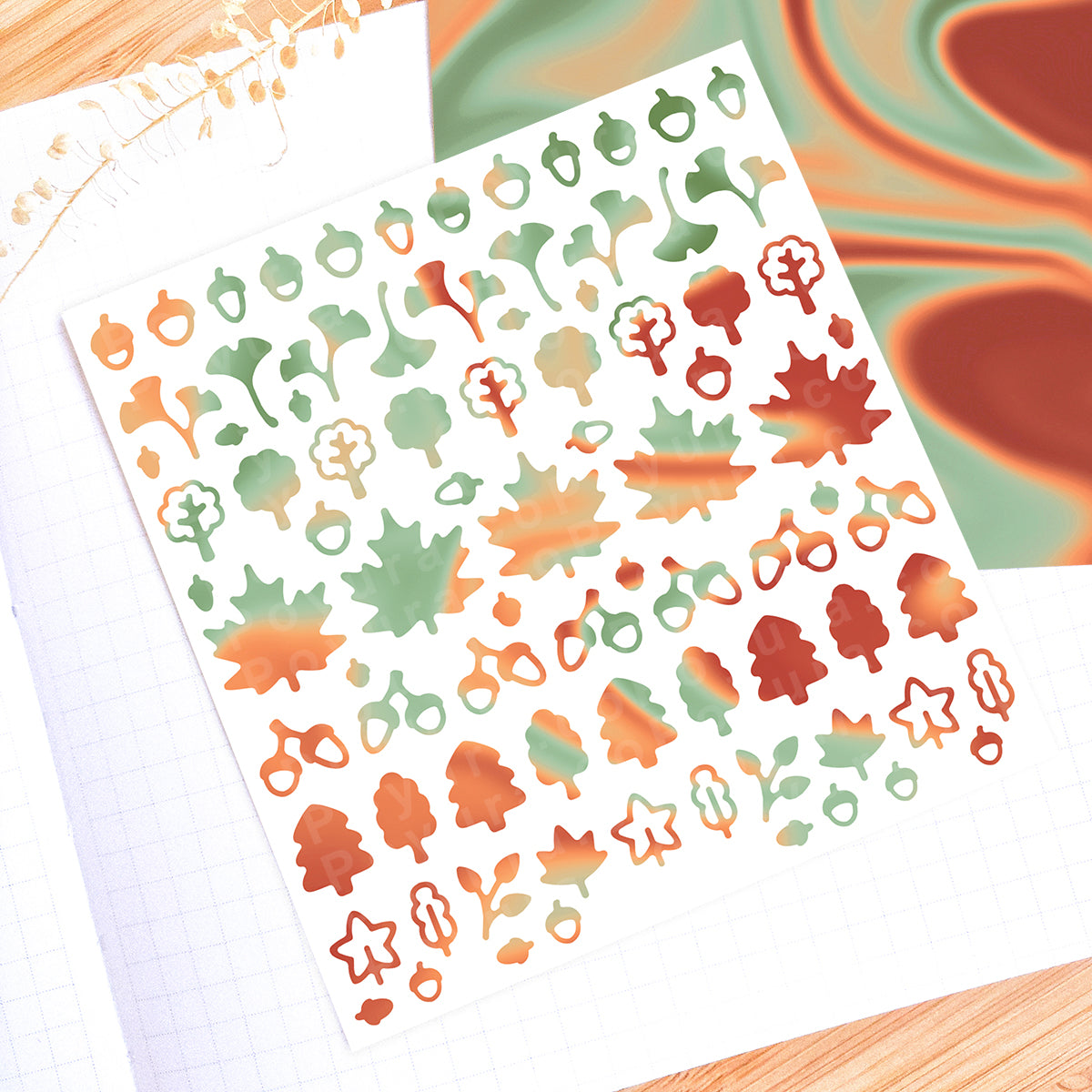 Borderless sticker with leaf and acorn cutouts in different green and red tints