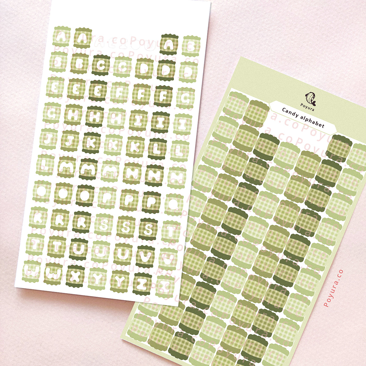 Two sticker sheets of green candies with alphabet letter cutouts in the center.