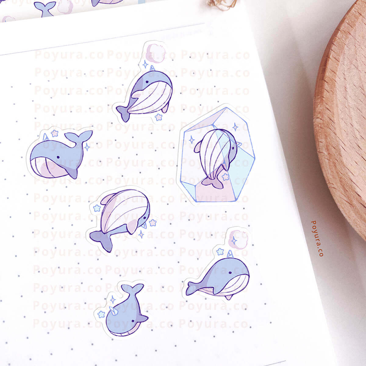 Sticker sheet with ice whale illustrations on a white background