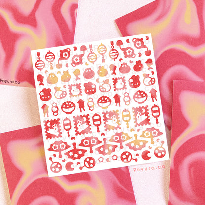 A deco sticker sheet with lunar new year-themed stickers. The sheet has swirls of red and yellow colors. 