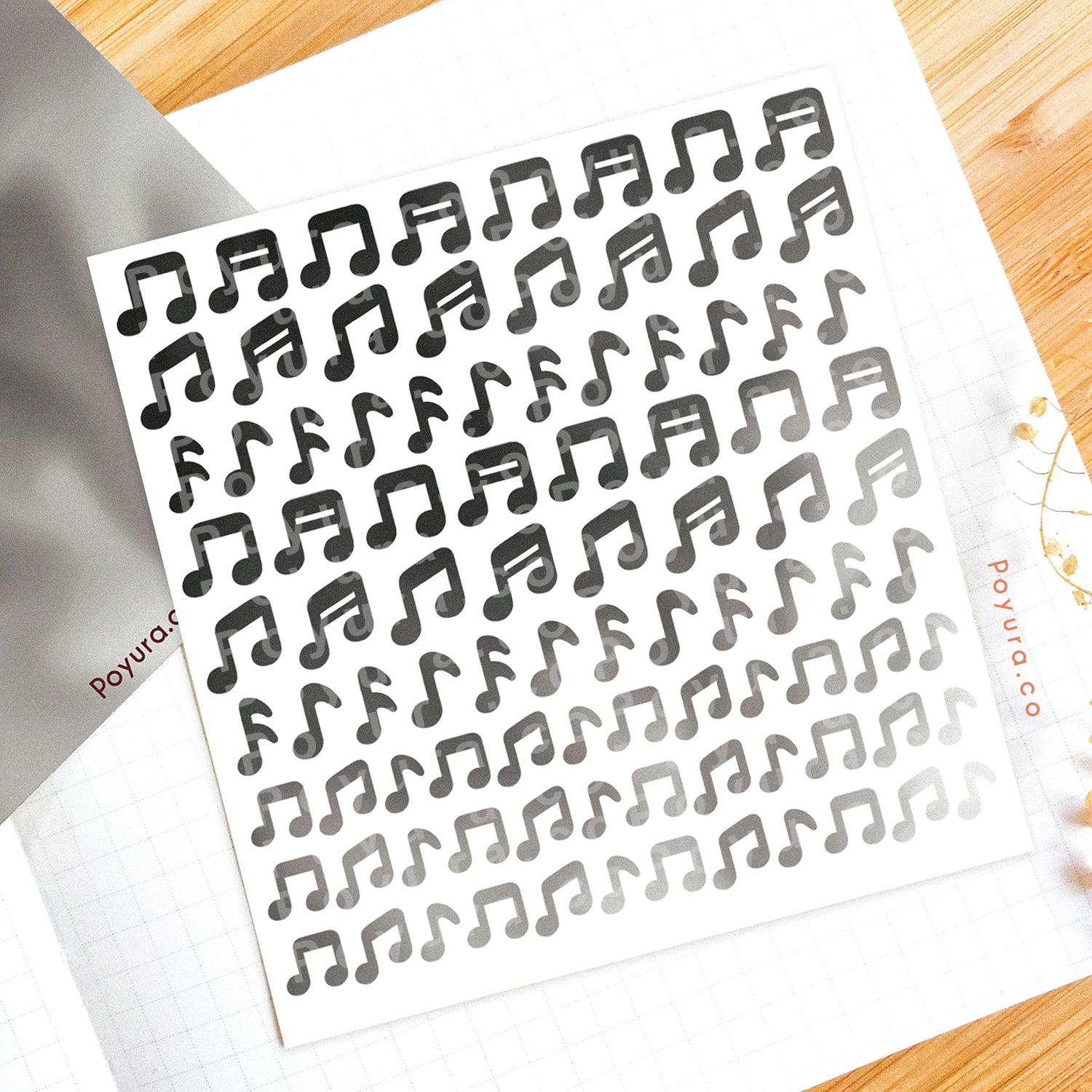 Borderless sticker with music note cutouts in different grey tints