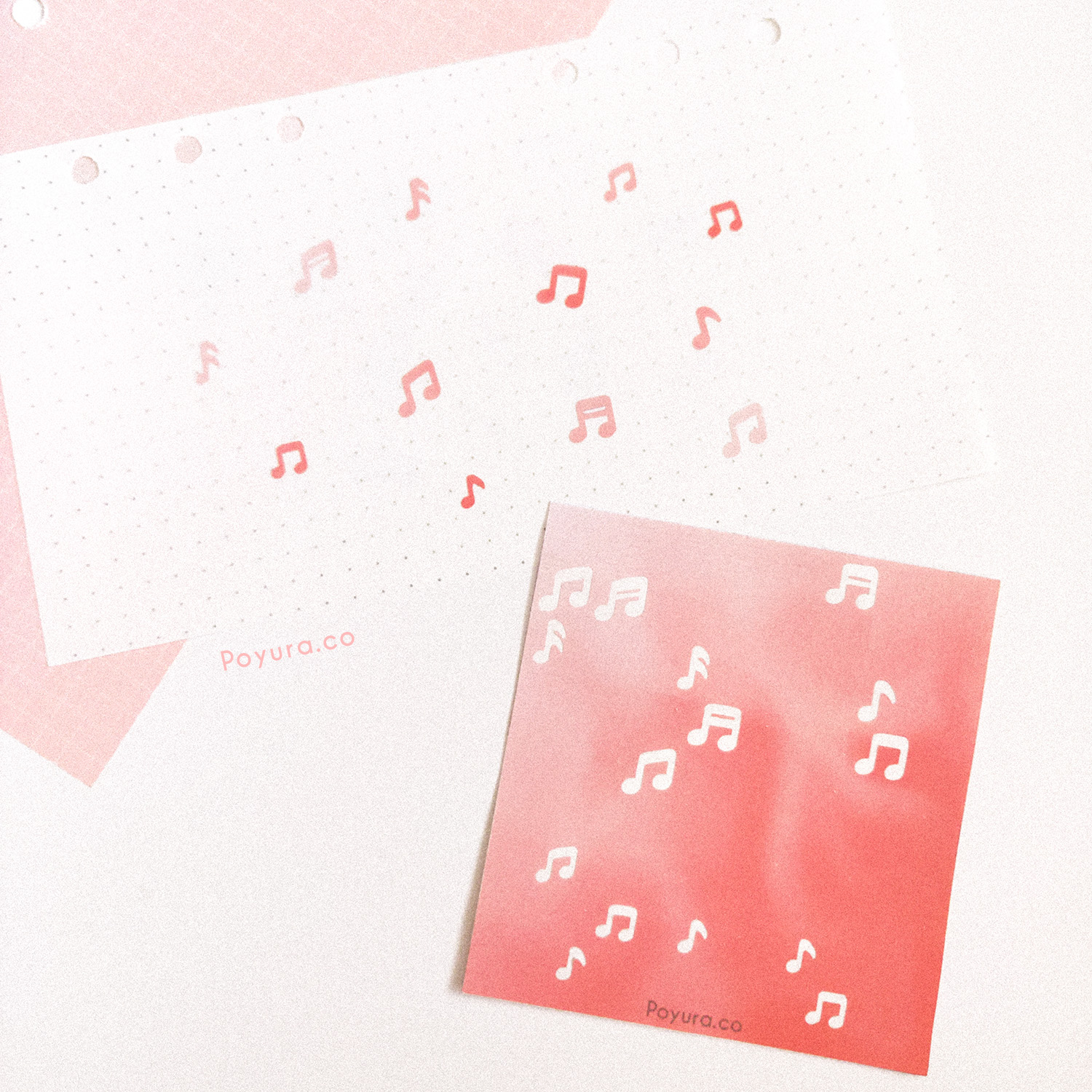 Borderless sticker with music note cutouts in different red tints