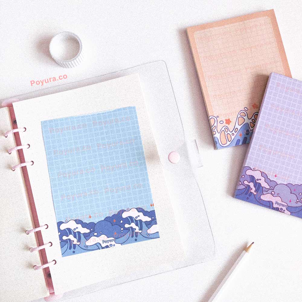 Bundle of notepad with grid and ocean waves