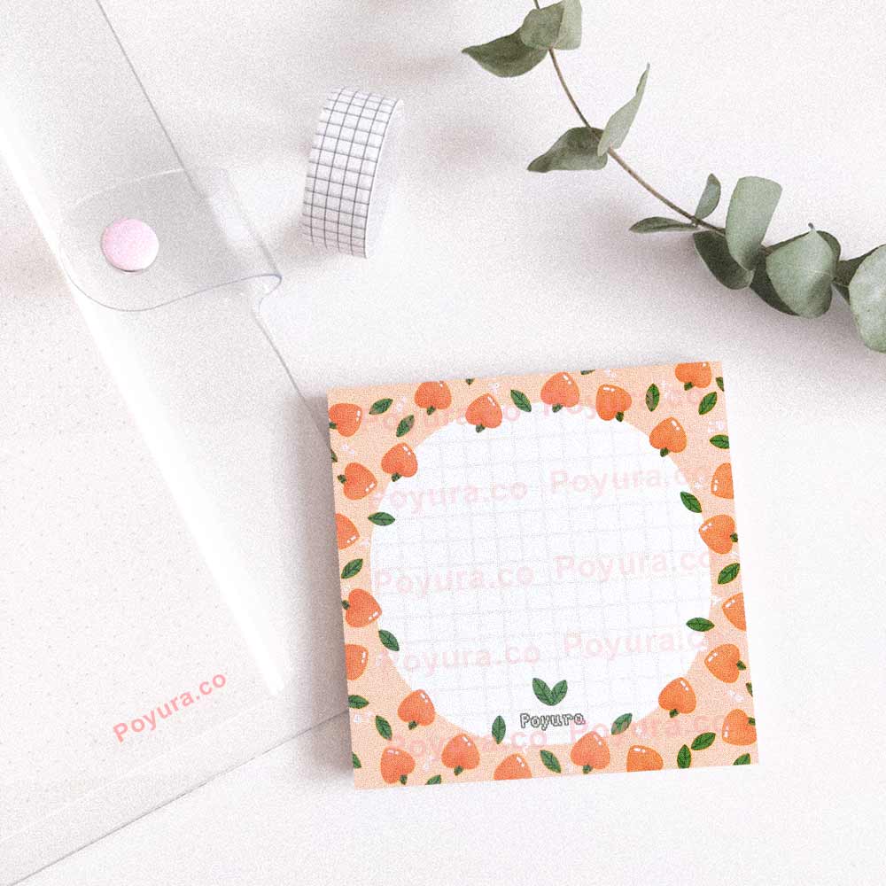 Squared peach memo notepad with white circle and grid inside