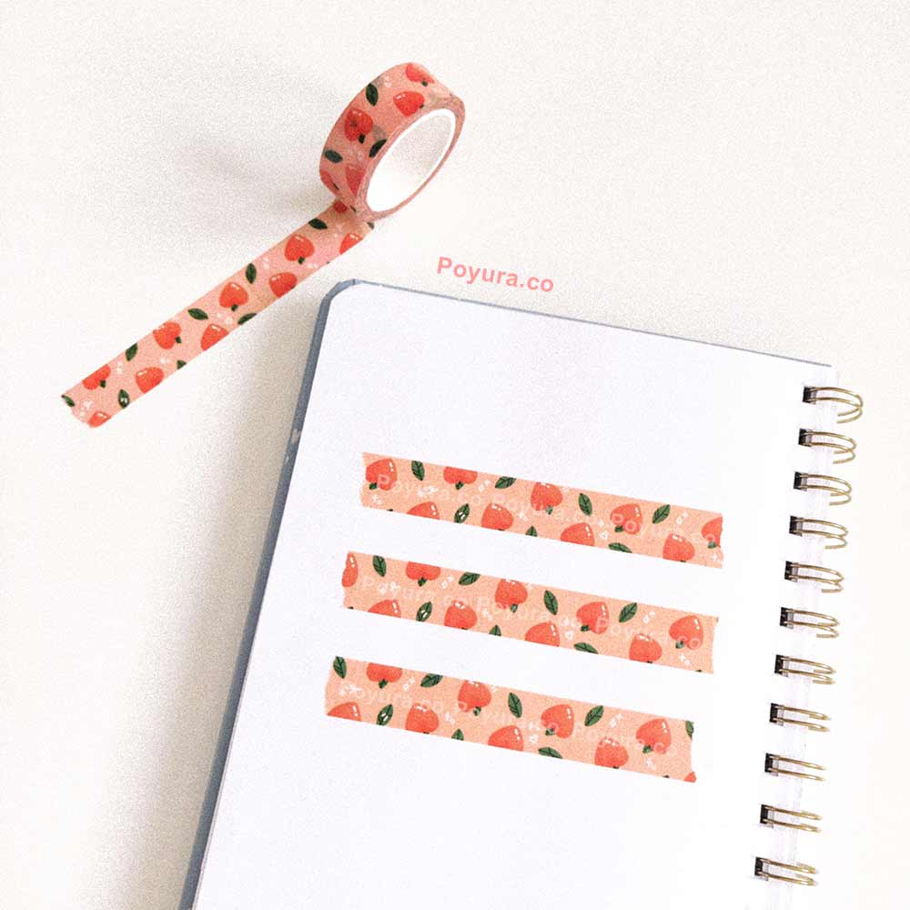 Orange 15 mm peach washi tape on notebook