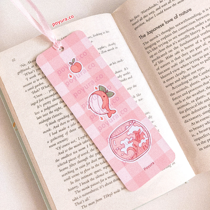 Pink checker pattern bookmark with peach whales