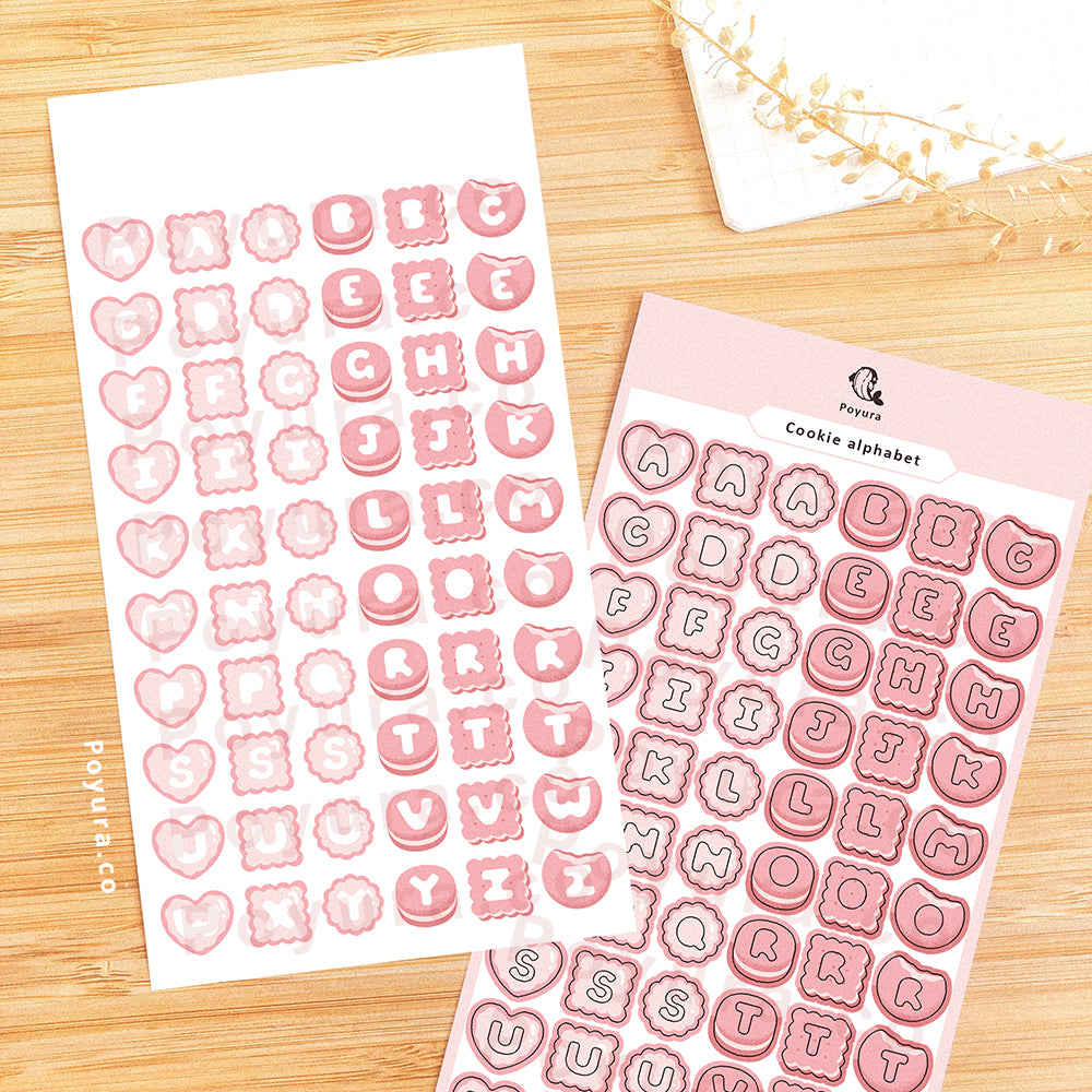 Sticker sheet of pink cookies with alphabet letter cutouts in the center. 