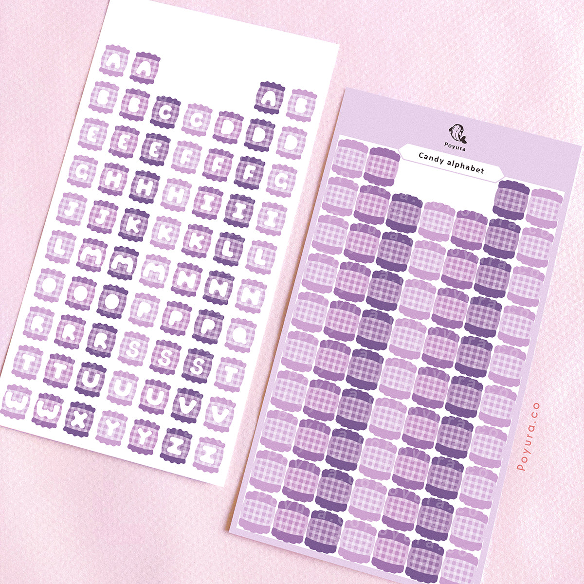 Two sticker sheets of purple candies with alphabet letter cutouts in the center.