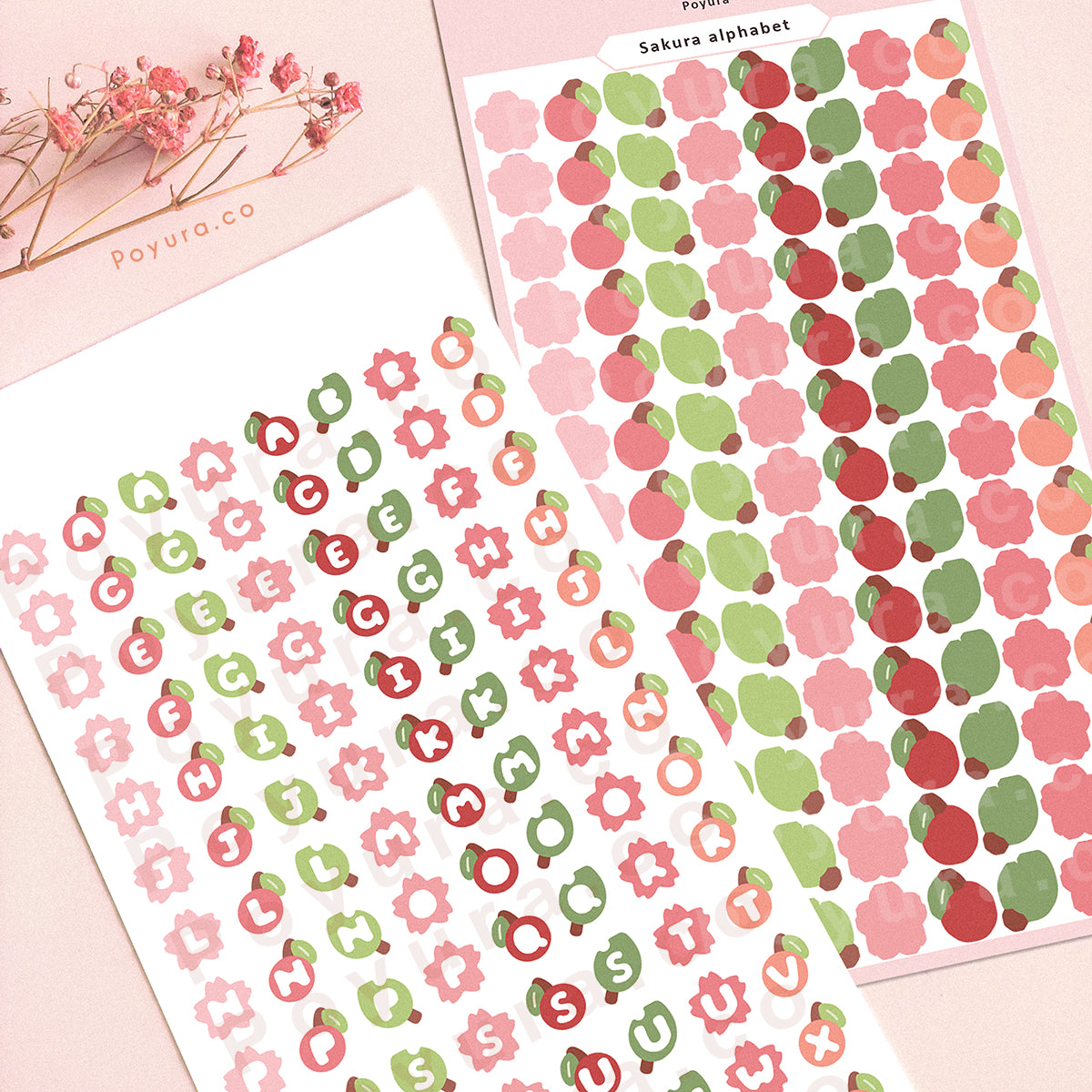 Sticker sheet of sakura, cherry, and leaves. They have alphabet letter cutouts in the center.