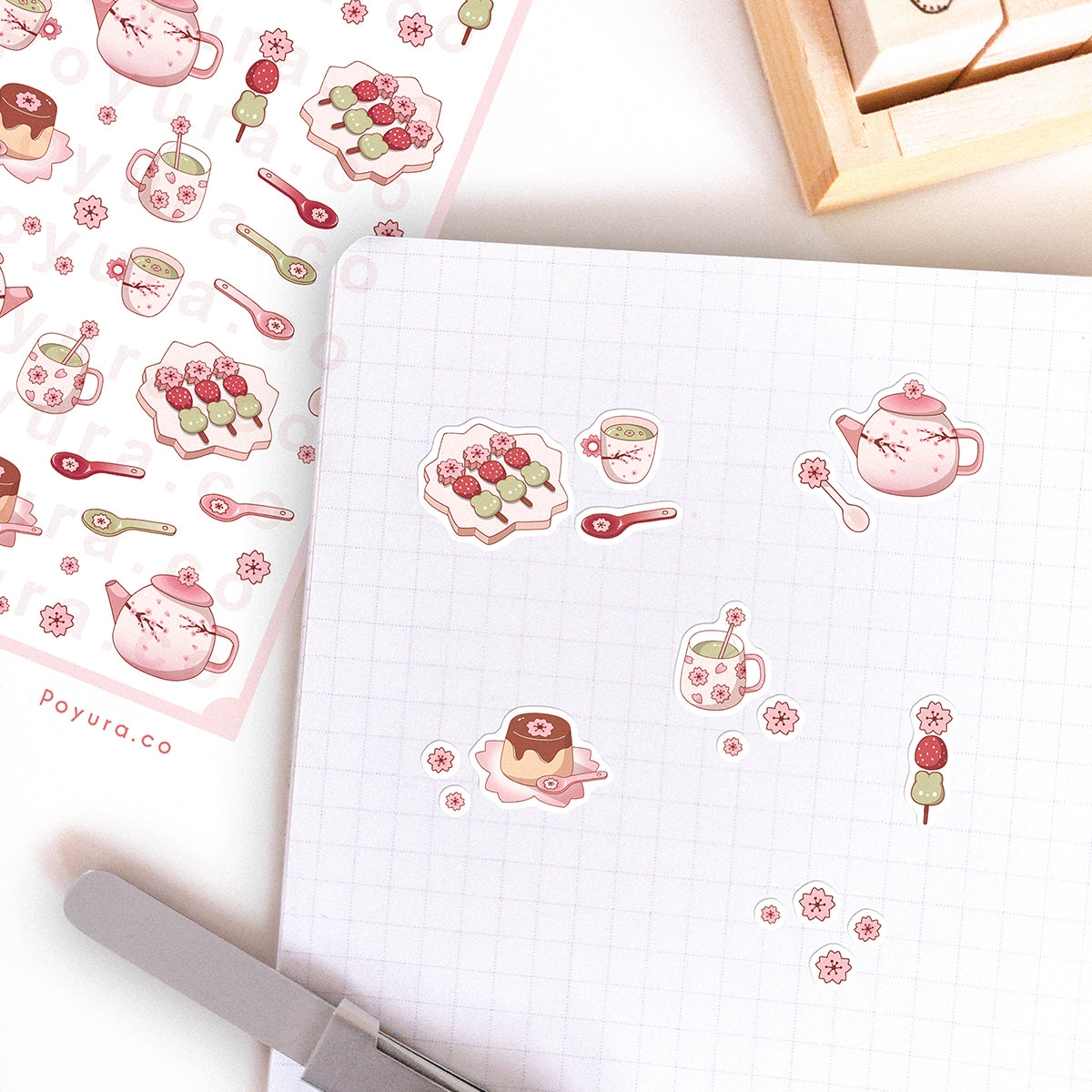 Stickers of cute sakura cherry blossom teapot set and snacks on a journal