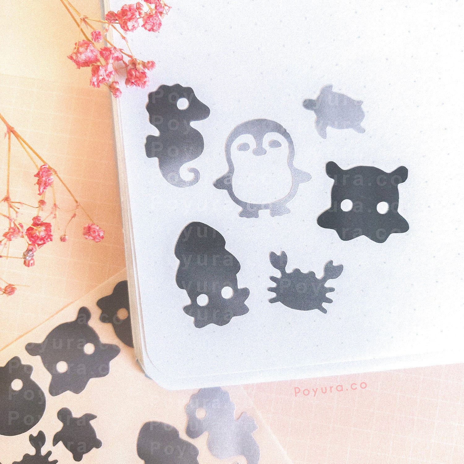 Borderless sticker with penguins, turtles, and other sea animal cutouts in different grey tints